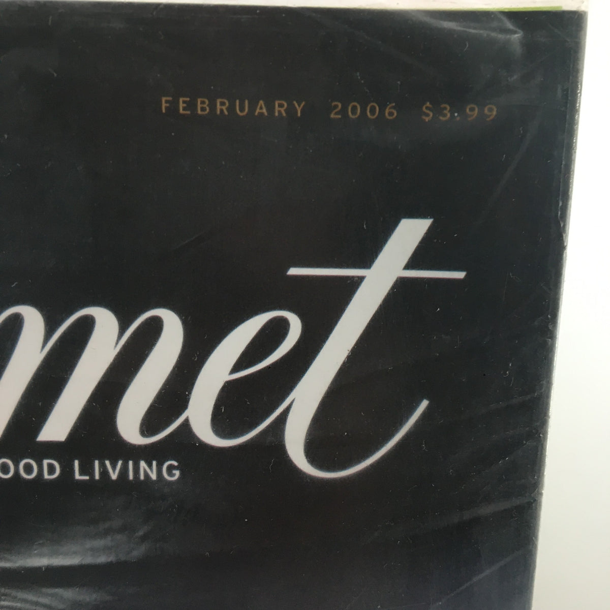 Cover of Gourmet Magazine February 2006 featuring a title that reads 'Gourmet' with a focus on food living, priced at $3.99. This issue includes insights on the best chocolates for baking, sold new and sealed.