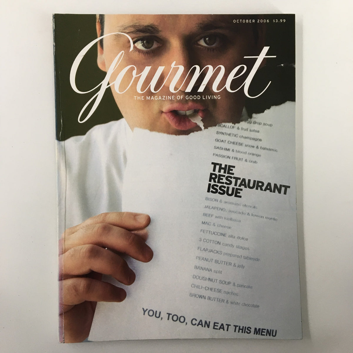 Cover of Gourmet Magazine October 2006 featuring the title 'The Restaurant Issue', with a close-up of a man holding a menu, symbolizing culinary exploration and gourmet cooking.