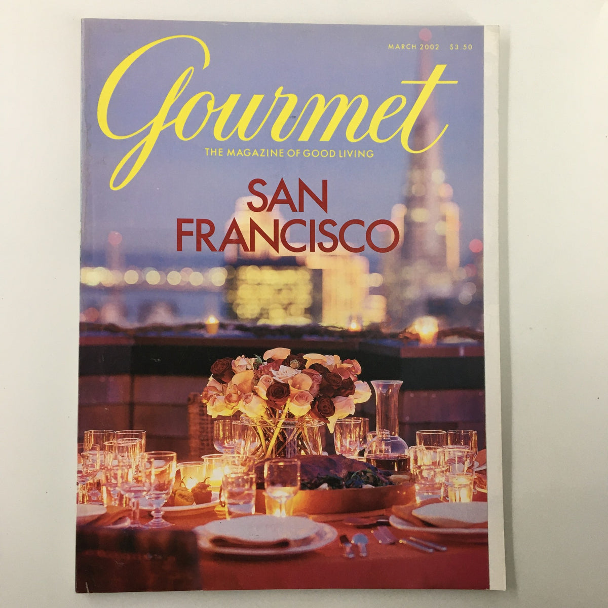 Cover of Gourmet Magazine March 2002, featuring a beautifully set table with floral decorations in San Francisco, showcasing the theme 'The Party Is About To Begin'.