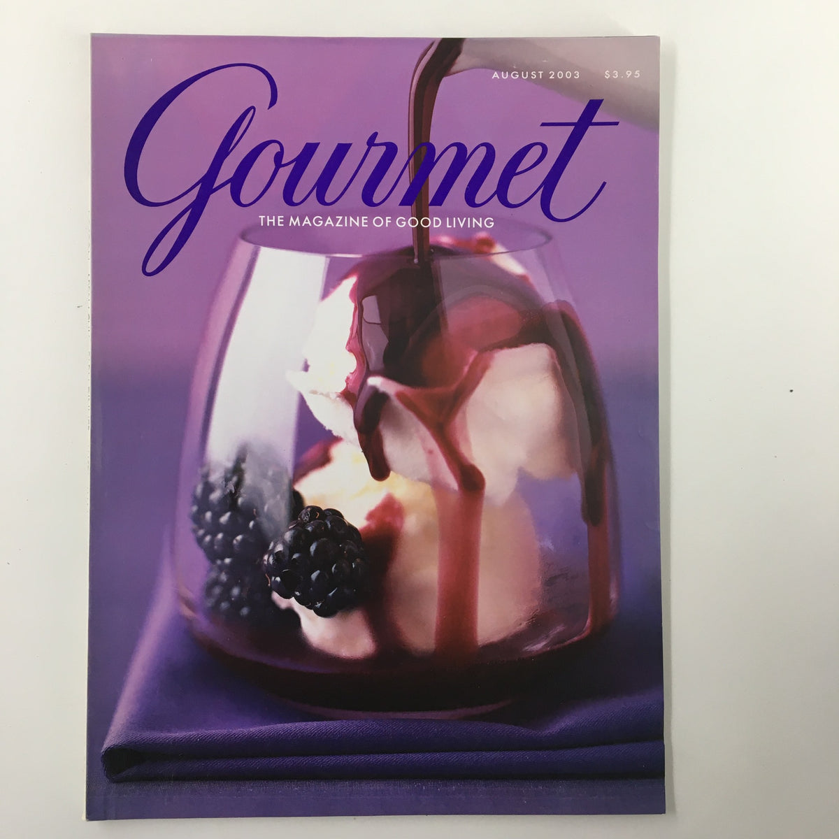 Gourmet Magazine August 2003 cover featuring a dessert with berries and chocolate, promoting playful culinary creativity.