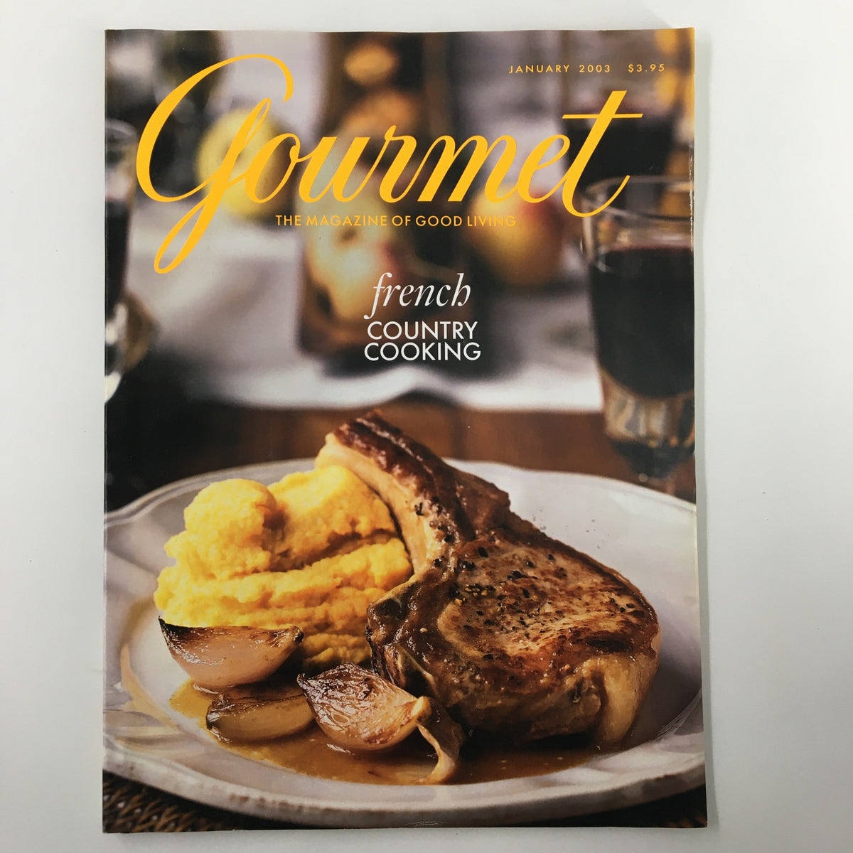 Cover of Gourmet Magazine January 2003 featuring a delectable dish of pork chop with mashed potatoes and onions, highlighting culinary excellence in the context of the Super Bowl theme.