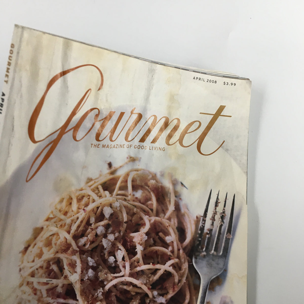 Close-up of the Gourmet Magazine April 2008 cover highlighting the title 'Gourmet: The Magazine of Good Living' over a spaghetti dish.