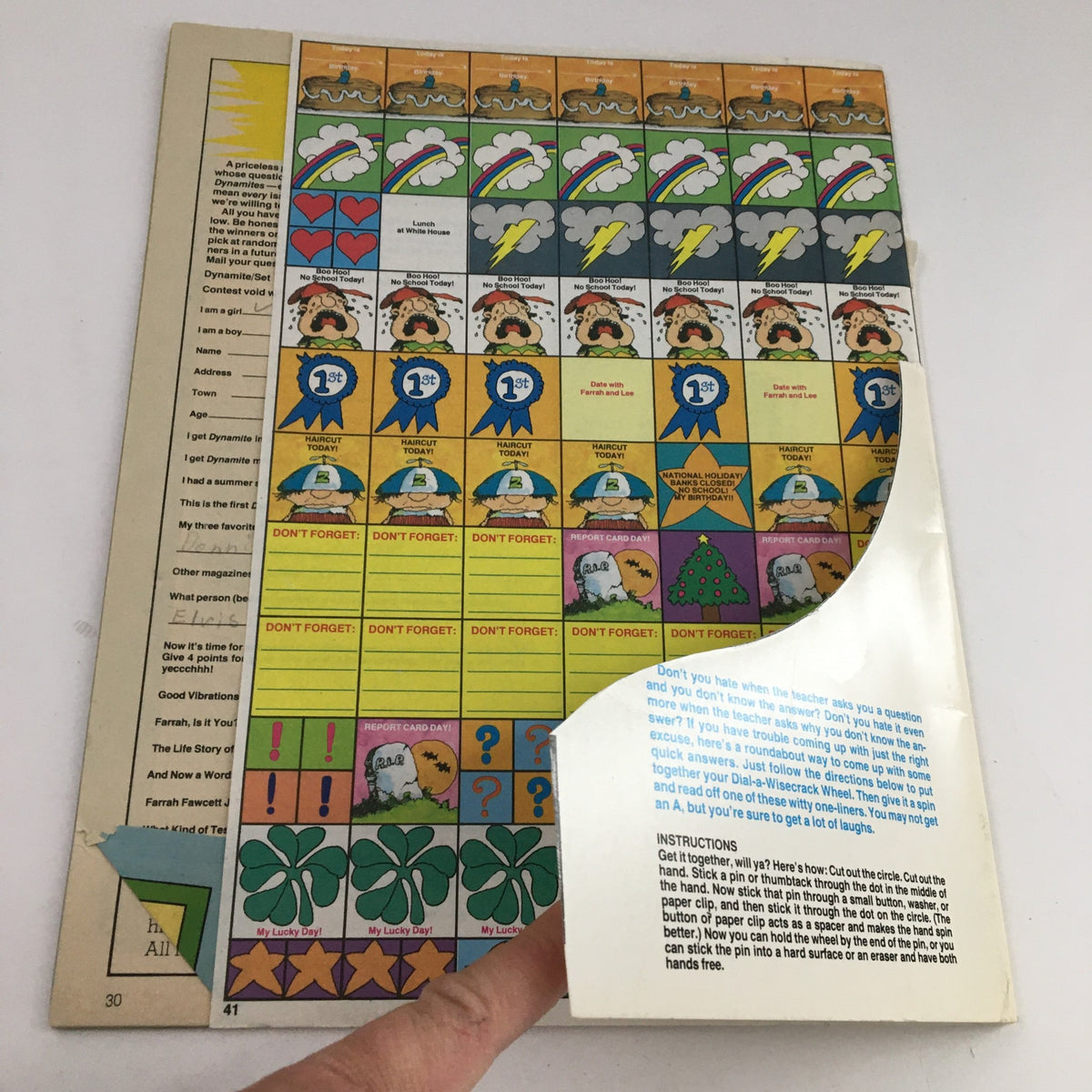 Back cover of Dynamite Magazine #40 featuring a colorful activity page with stickers, tasks, and instructions for kids. This collectible magazine showcases American actress Farrah Fawcett on the cover and includes various nostalgic elements from the era.