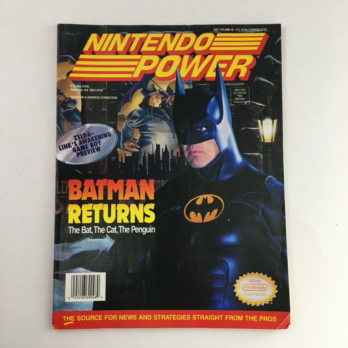 Cover of Nintendo Power Magazine May 1993 Vol 48 featuring Batman Returns: The Bat, The Cat, and The Penguin. The cover showcases Batman in a cityscape, highlighting the magazine's focus on the iconic characters from the film.