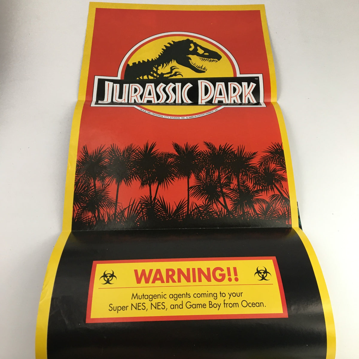 Inside spread from Nintendo Power Magazine June 1993 Vol 49 dedicated to Jurassic Park game announcement, featuring bold graphics and warnings.