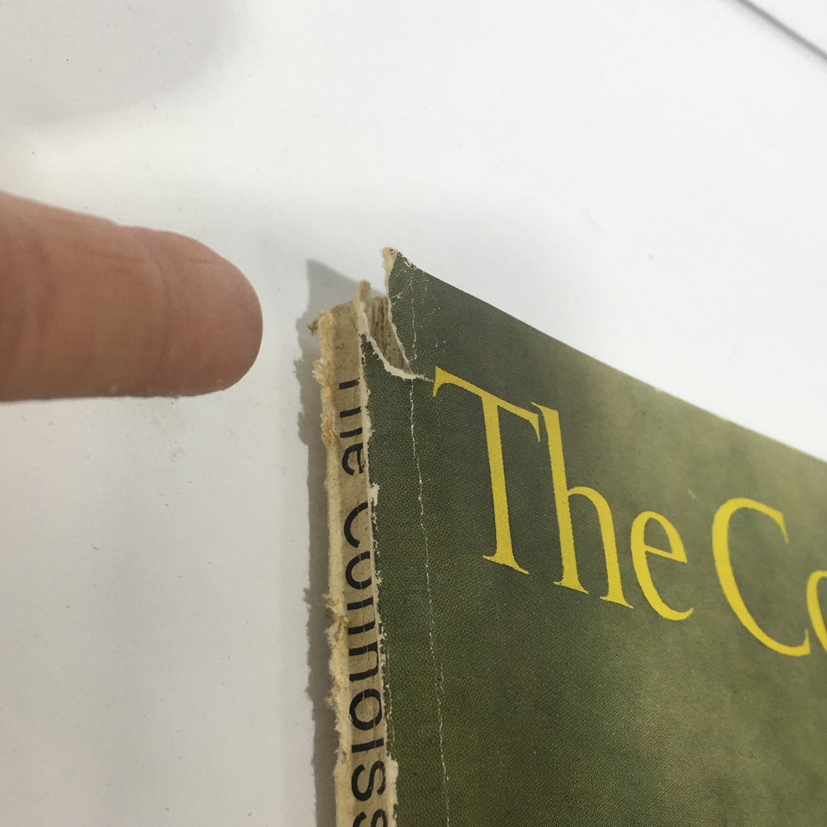 Close-up of the spine of VTG The Connoisseur Magazine April 1963, illustrating signs of wear and the magazine's historic authenticity.