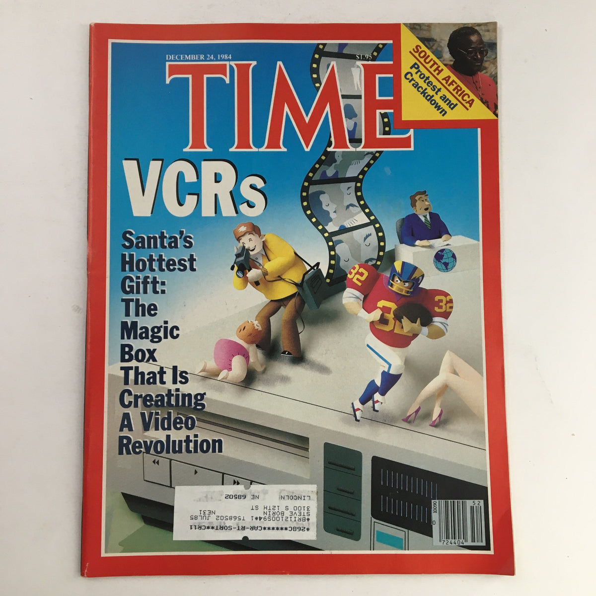 Cover of Time Magazine from December 24, 1984 featuring VCRs titled 'Santa's Hottest Gift: The Magic Box That Is Creating A Video Revolution', along with a highlight on South Africa Protests.