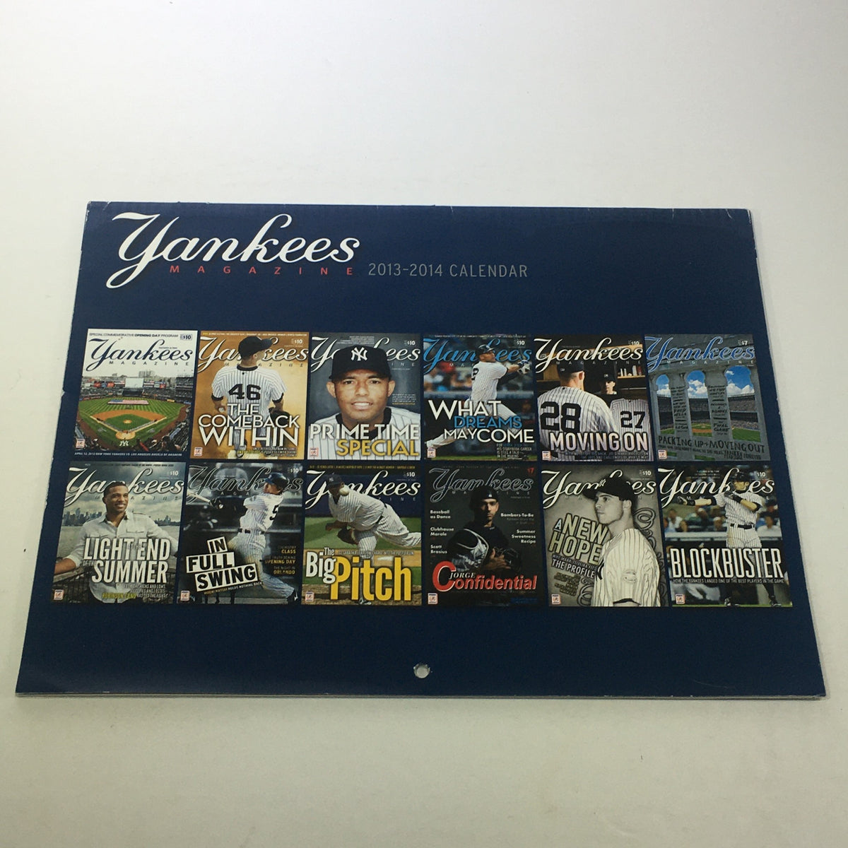 VTG 2013-2014 Yankees Magazine Calendar cover featuring monthly themes and iconic Yankees players, showcasing nostalgia and baseball history.
