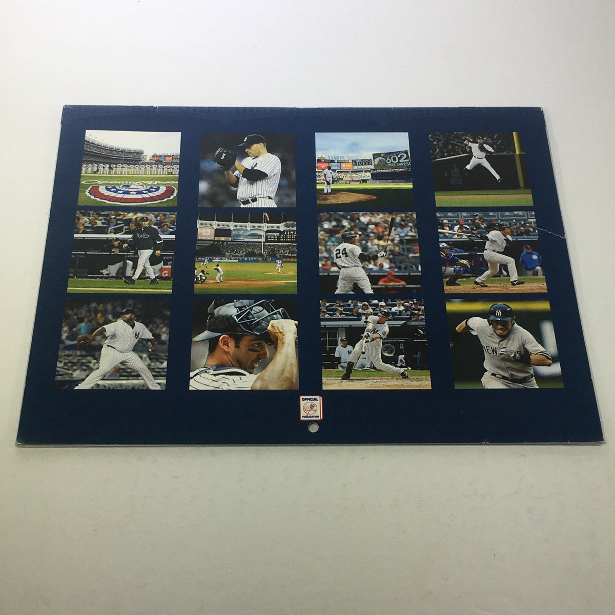 Back cover of the VTG 2013-2014 Yankees Magazine Calendar displaying a collage of memorable Yankees game moments.