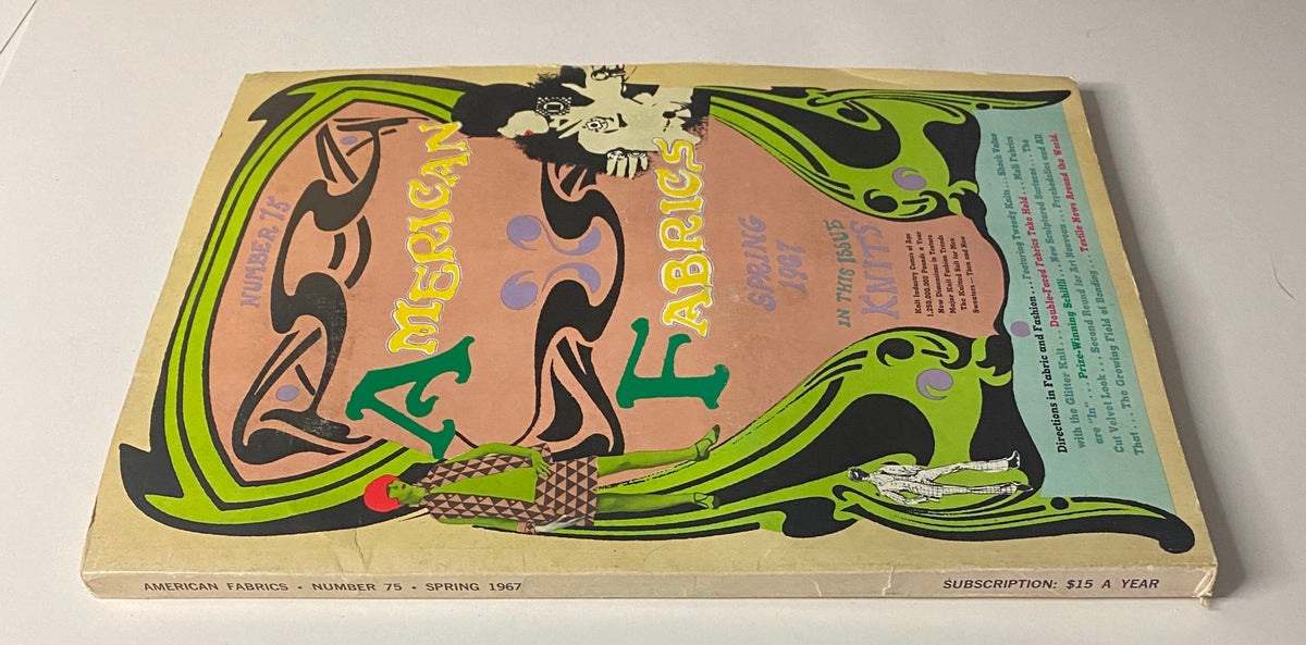 Side view of the 1967 American Fabric No. 75 Spring Catalog, emphasizing its vintage design and colorful cover art depicting fabric styles and trends from the 1960s.