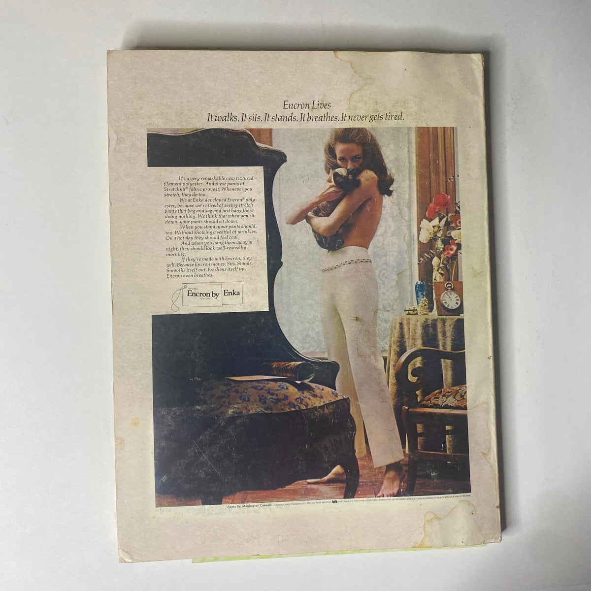 Back cover of the 1968 American Fabrics Summer Catalog featuring an advertisement for Encron polyester fabric with a model, highlighting the fabric's unique features.