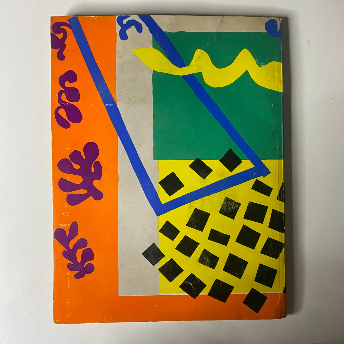 Cover of the 1957 American Fabrics Spring Catalog featuring vibrant abstract artwork, showcasing design trends and textile innovations of the era.