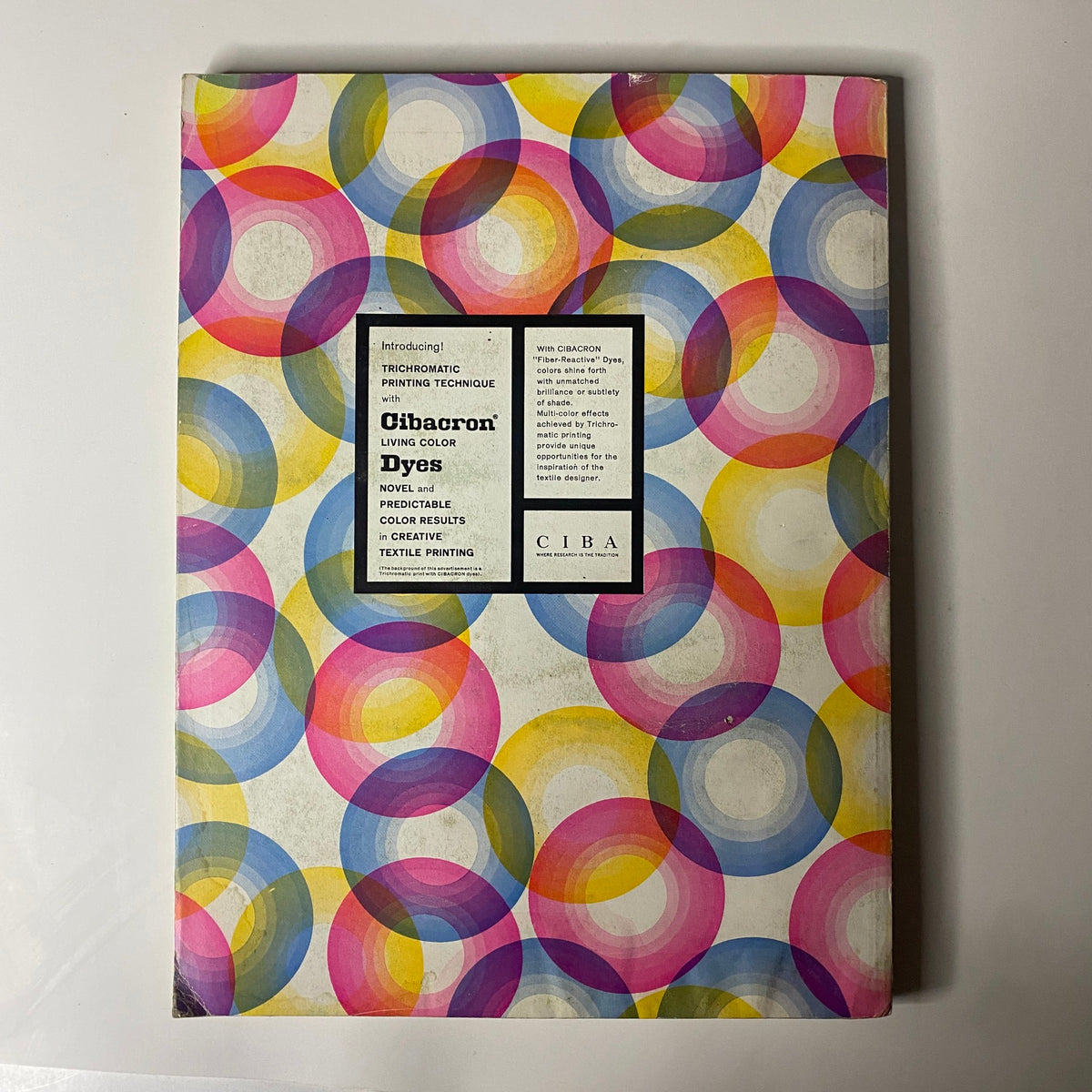 Cover design of the 1960 American Fabrics No. 50 Summer Catalog, showcasing vibrant colors and patterns with a modern aesthetic, reflecting innovation in textile printing.