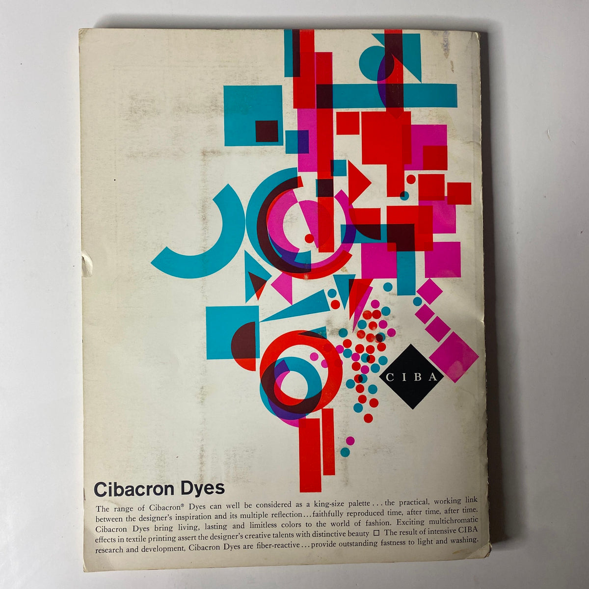 Cover image of the 1961 American Fabrics No. 52 Spring Catalog titled 'Cibacron Dyes' featuring a colorful geometric design representing the vibrant palette available in textile dye.