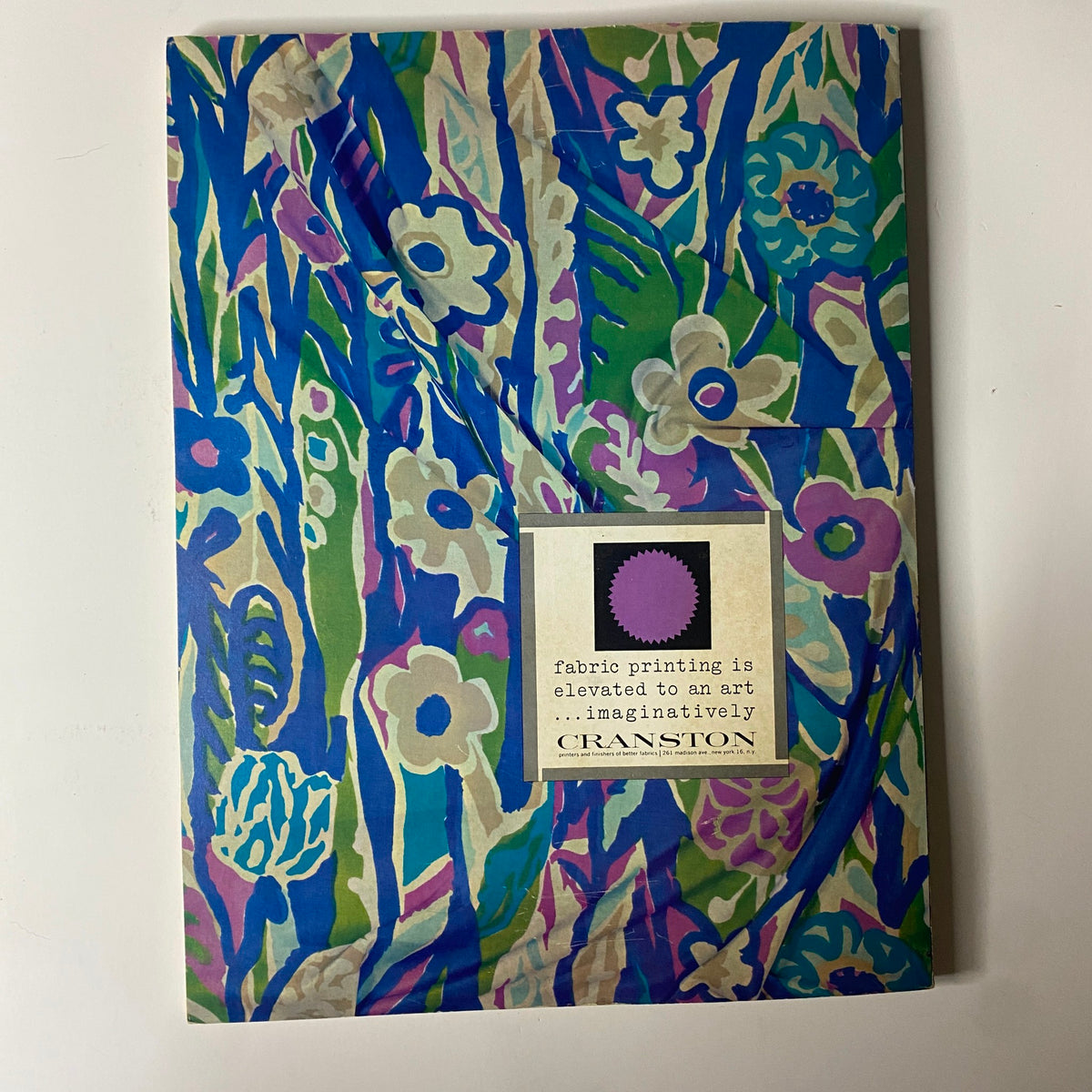 Cover of the 1963 American Fabrics No. 62 Fall and Winter Catalog featuring vibrant floral fabric print designs by Cranston, showcasing innovative textile art.