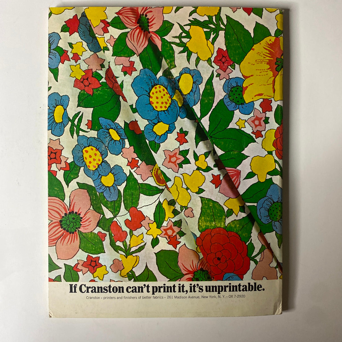 Colorful floral print cover from the 1964-1965 American Fabrics No. 66 Winter Catalog showcasing vibrant fabric designs.