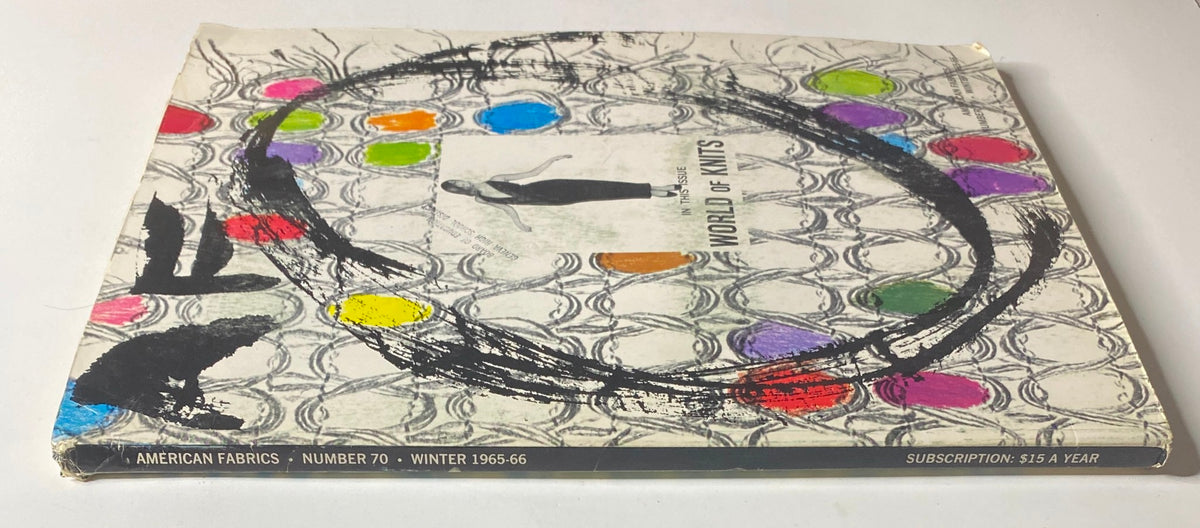 Spine view of the 1965-1966 American Fabrics No. 70 Winter Catalog, highlighting its colorful cover design centered around 'World of Knits' and containing details of the magazine's publishing information.