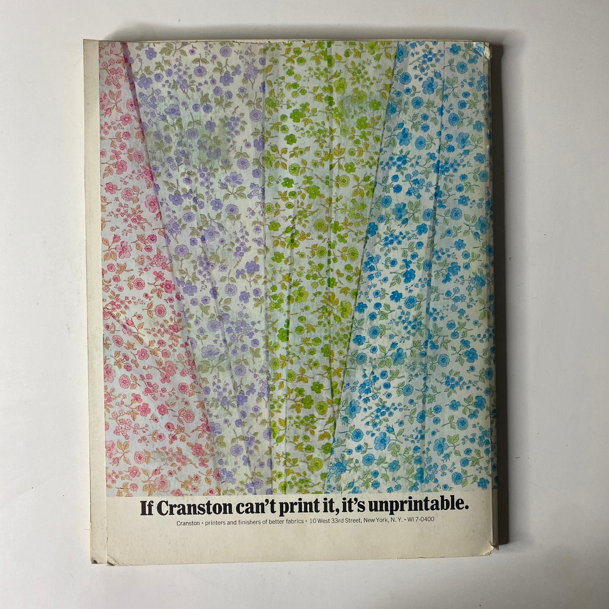 Cover of the 1965-1966 American Fabrics No. 70 Winter Catalog featuring colorful floral textile prints with a tagline saying 'If Cranston can't print it, it's unprintable.' Perfect for collectors and enthusiasts of mid-century textile design.