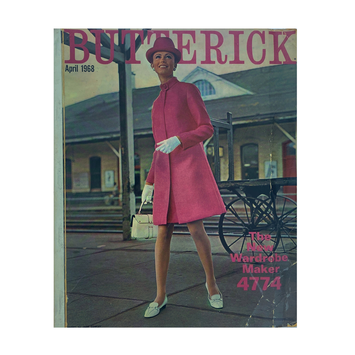 1968 April Butterick Catalog cover featuring a model in a pink coat and hat, standing outdoors, showcasing vintage fashion designs.