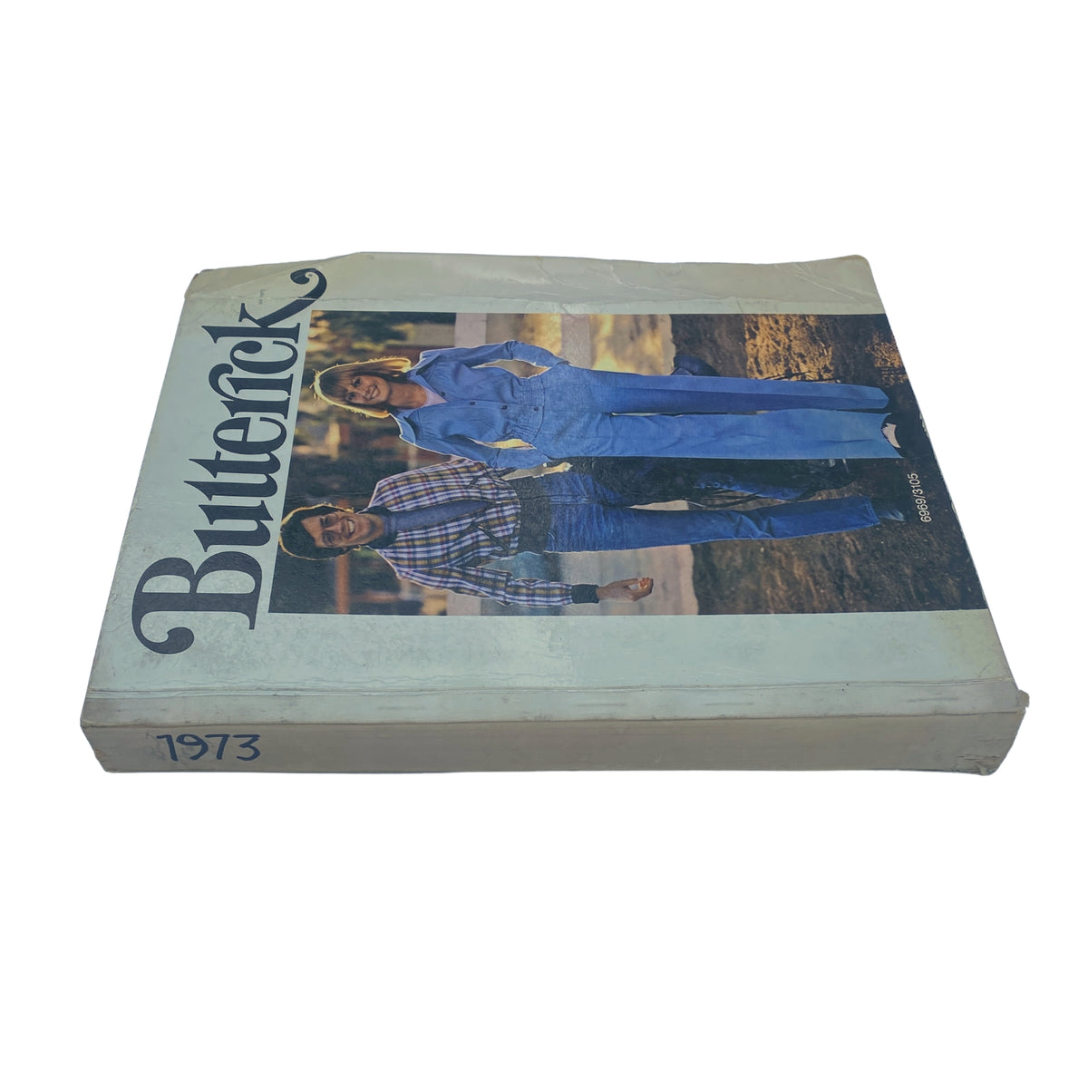 Side view of the 1973 May Butterick Catalog, highlighting the product title and illustration of a couple wearing matching outfits.