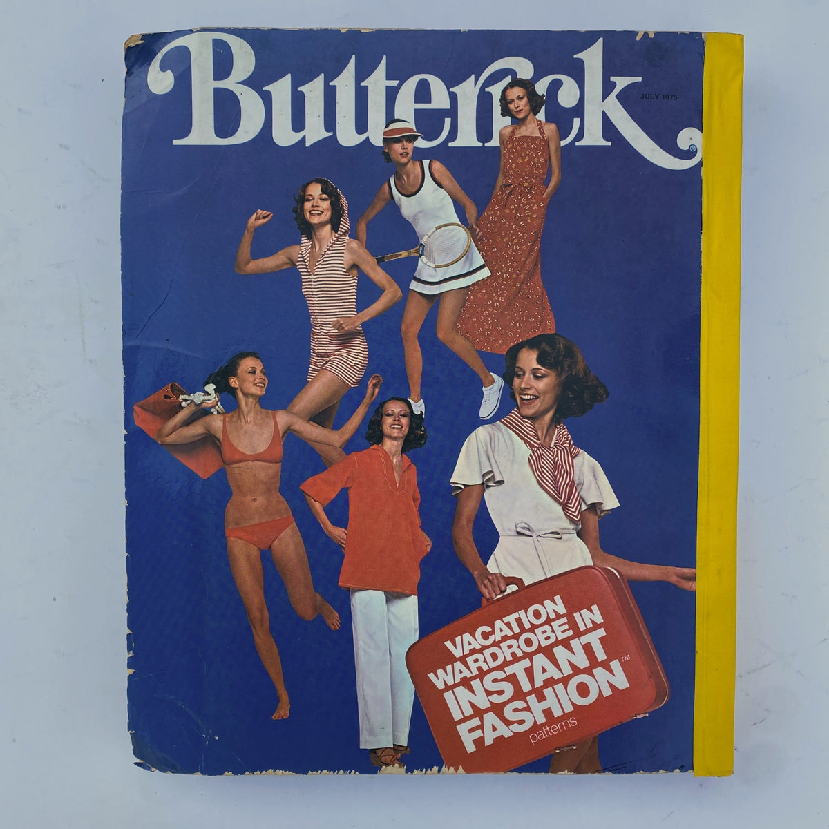 Cover of the 1975 July Butterick Summer Catalog, featuring vibrant fashion illustrations showcasing summer styles such as swimsuits, dresses, and casual outfits. Ideal for collectors of vintage fashion magazines.
