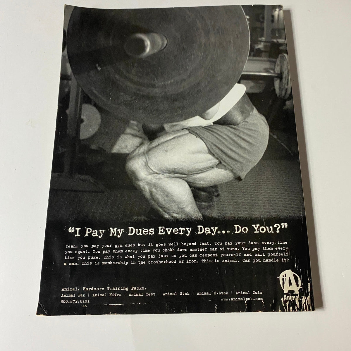 Back cover of Iron Man Magazine September 2004, featuring a motivational fitness quote, emphasizing dedication and hard work in training.