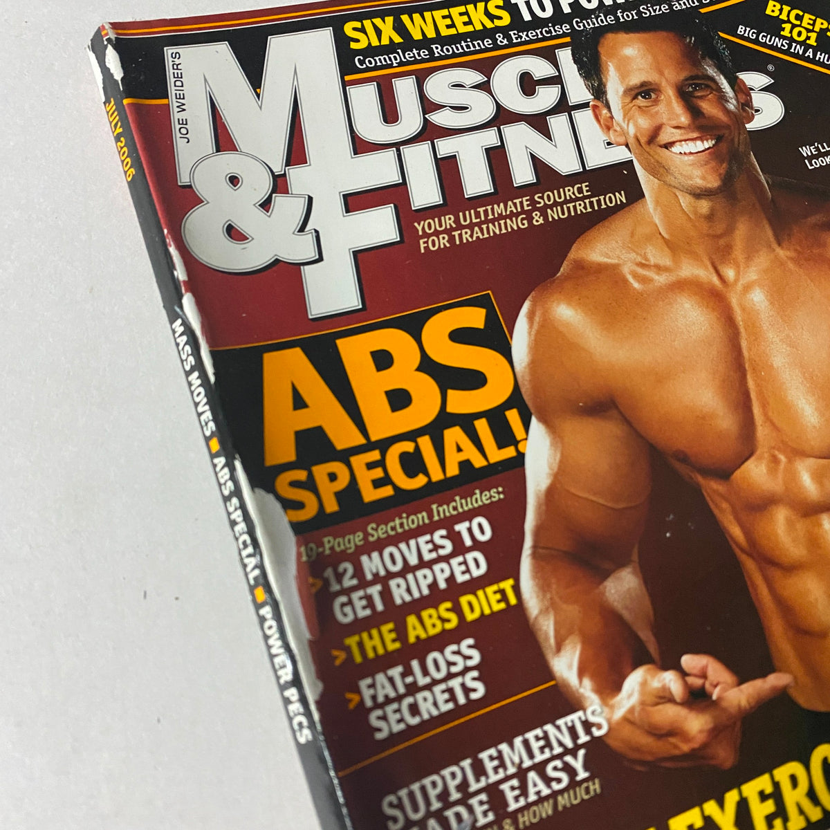 Close-up of the Muscle & Fitness Magazine July 2006 Vol 67 No. 7 cover highlighting an ABS special section with workout routines and diet secrets.