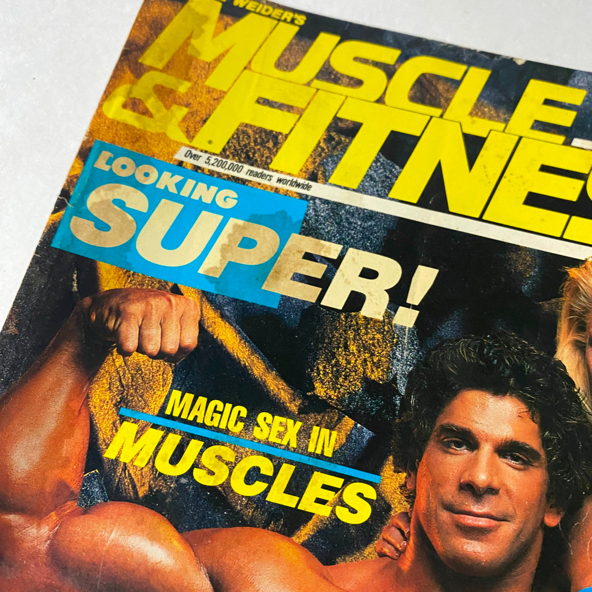 Close-up of the cover of Muscle & Fitness Magazine April 1989 showcasing Lou Ferrigno, emphasizing the striking promotional text 'Looking Super!' and 'Magic Sex in Muscles.' Perfect for enthusiasts of fitness history.