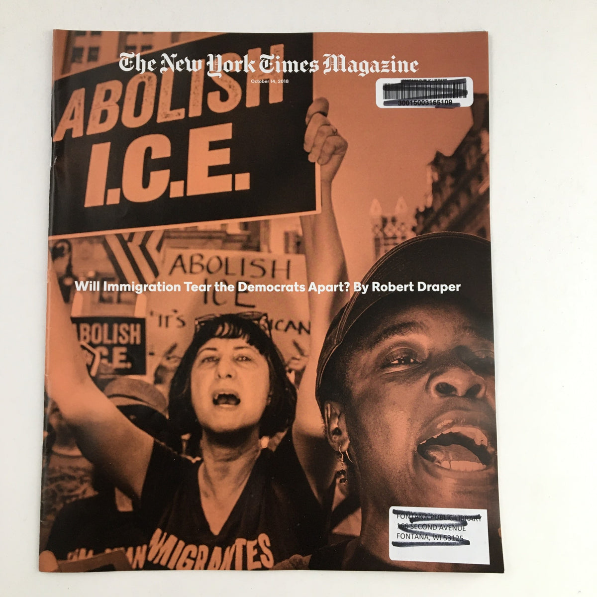 The New York Times Magazine October 14 2018 cover, featuring a powerful image of demonstrators advocating to abolish ICE, with bold text asking, 'Will Immigration Tear the Democrats Apart? By Robert Draper.' This edition highlights crucial immigration discussions.