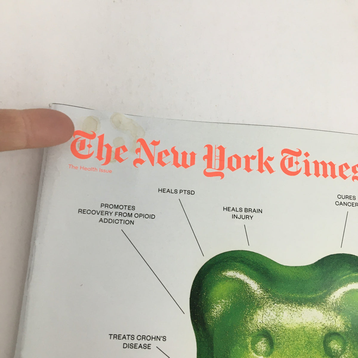 Another close-up of The New York Times Magazine May 19 2019 cover, highlighting the title and a green gummy bear, with text about CBD promoting recovery from opioid addiction.