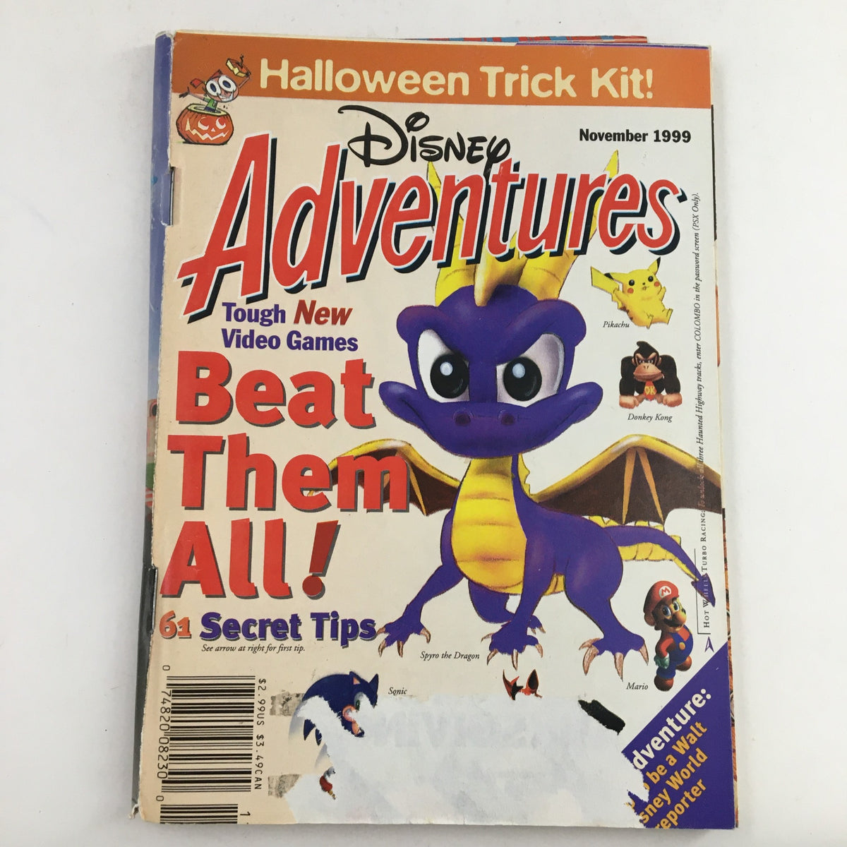 Cover of Disney Adventures Magazine from November 1999 featuring classic video game characters including Pikachu, Donkey Kong, and Mario. The magazine highlights tips for tough new video games and showcases Spyro the Dragon prominently.