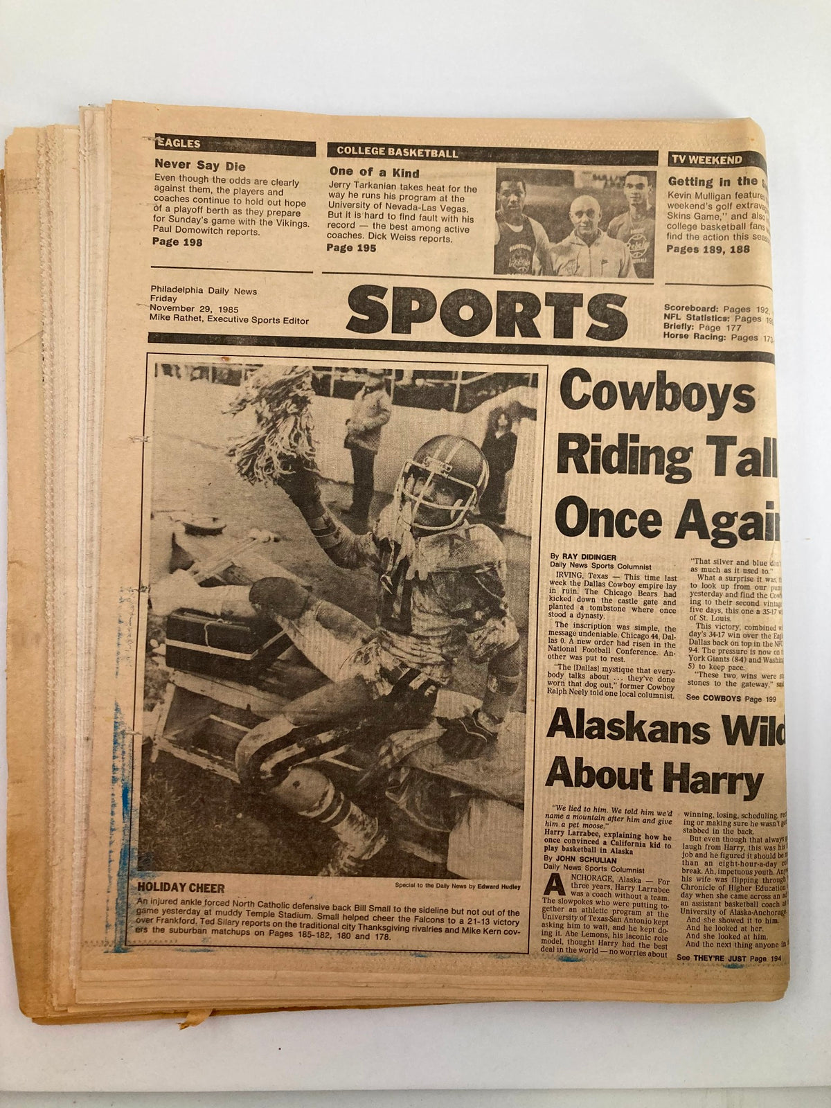 Philadelphia Daily News Tabloid from November 29, 1985 featuring the Swan Junior High School Band and sports news including the Cowboys and collegiate basketball updates.