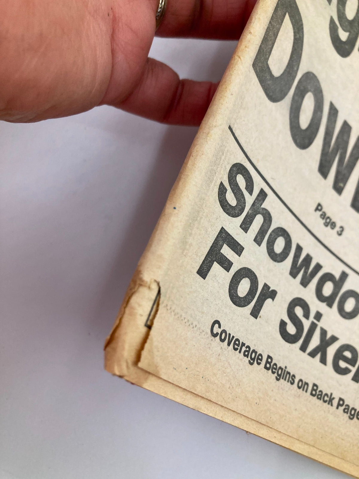 Close-up view of the Philadelphia Daily News tabloid from June 8, 1982, showing minor wear and corner damage, highlighting its vintage character related to MLB Phillies Larry Bowa.