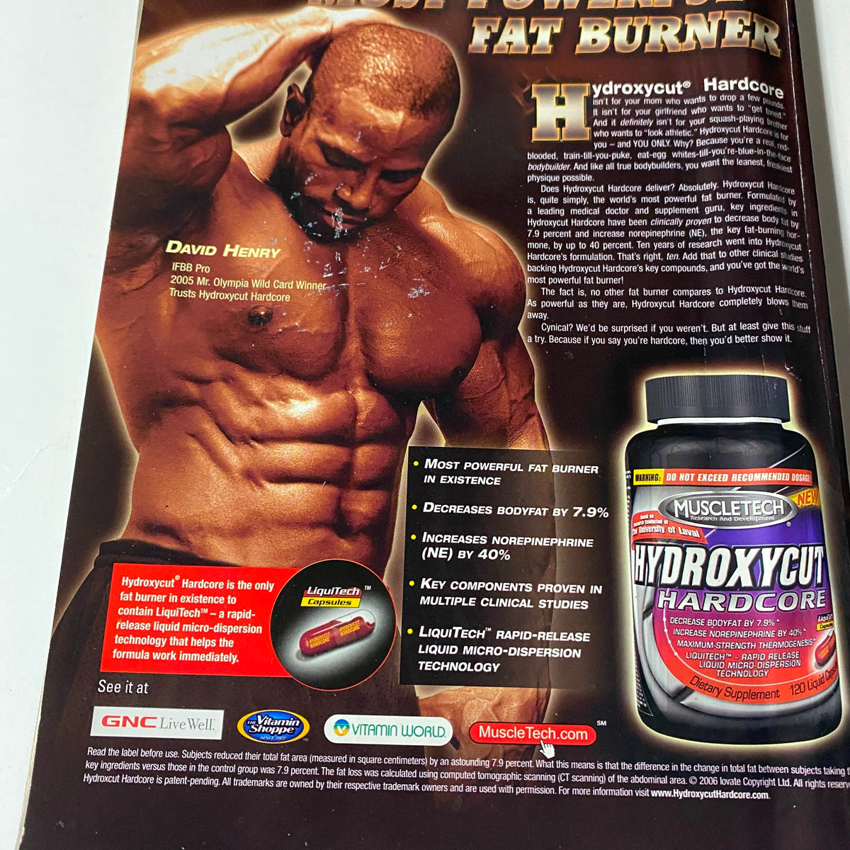 Hydroxycut Hardcore advertisement featured in Iron Man Magazine July 2006 Vol 65 No. 7, showcasing David Henry, 2005 Mr. Olympia Award Winner, promoting a fat burner supplement with key benefits and imagery.