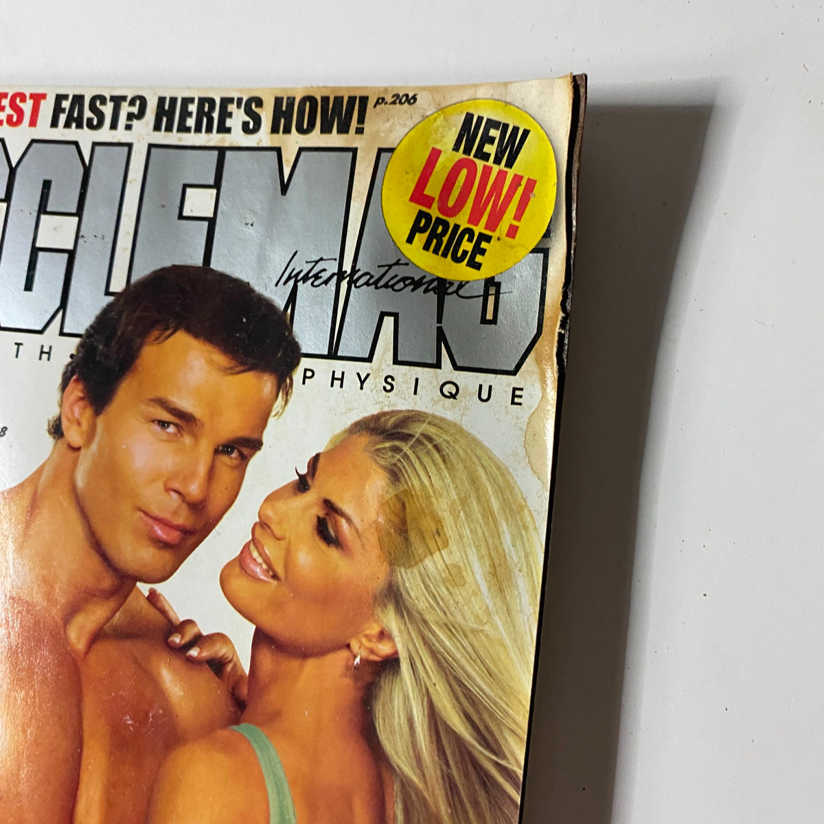 Cover of MuscleMag Int'l Magazine August 2005 featuring a couple, with the text 'NEW LOW PRICE!' prominently displayed, showcasing vintage bodybuilding culture.