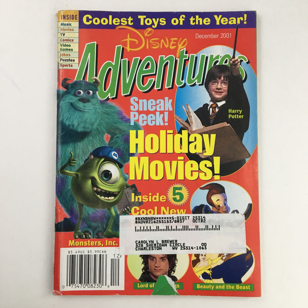 Disney Adventures Magazine December 2001 featuring Harry Potter and Monsters Inc. on the cover. The magazine highlights cool toys of the year and holiday movies.