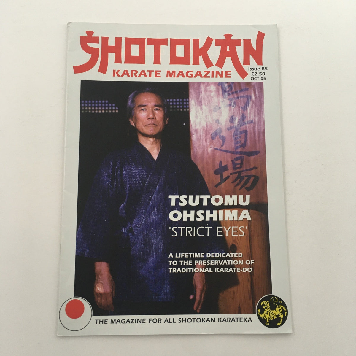 Cover of Shotokan Karate Magazine October 2005 Issue #85 featuring Sensei Tsutomu Oshima, showcasing a dedication to traditional karate-do with an artistic design.