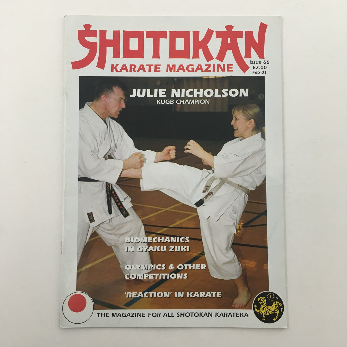 Shotokan Karate Magazine February 2001 featuring Julie Nicholson, KUGB Champion, showcasing karate techniques including biomechanics in Gyaku Zuki, and topics on the Olympics and competitions.