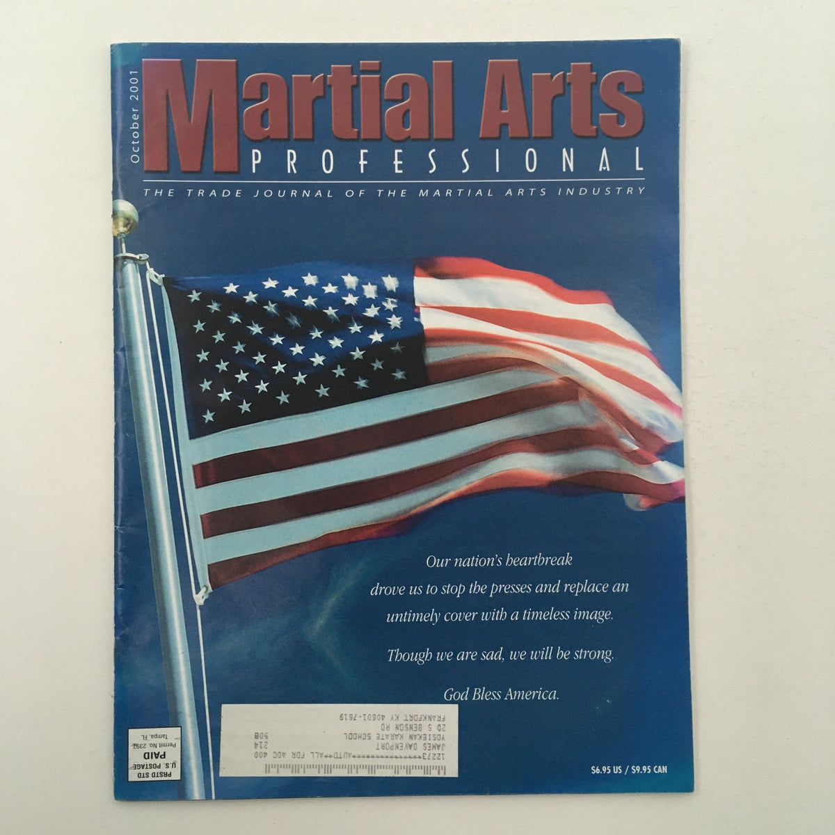 Cover of Martial Arts Professional Magazine October 2001 featuring an American flag, highlighting the theme of resilience with the title 'Teaching The Reluctant Victim'.