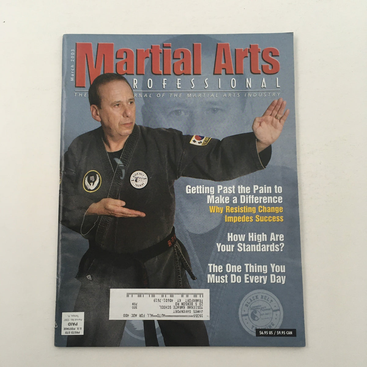 Cover of Martial Arts Professional Magazine March 2003 featuring Master Charlie Foxman in a martial arts pose, showcasing the journal of the martial arts industry.
