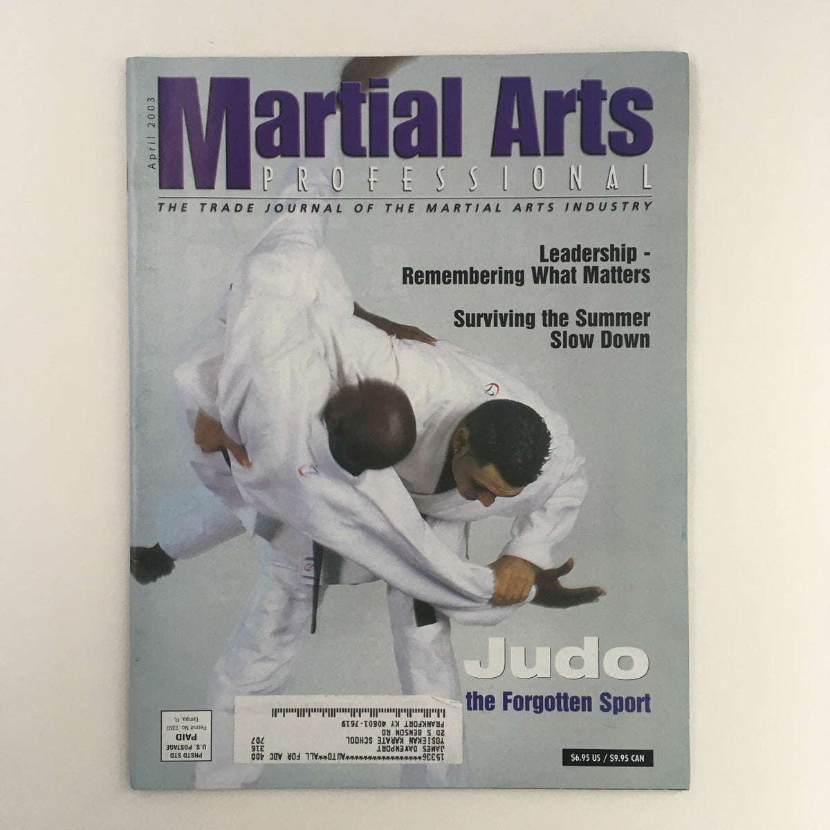 Cover of Martial Arts Pro Magazine April 2003 featuring notable martial artists Rebecca Barnett and Jason Morris, showcasing articles and insights on martial arts techniques and philosophies.