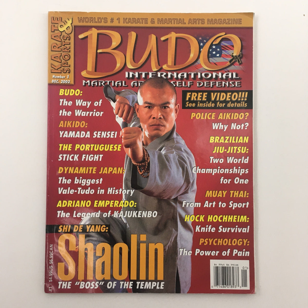 Cover of Budo International Magazine December 2002 featuring martial artist Adriano Emperado, highlighting Kajukenbo and various martial arts disciplines.