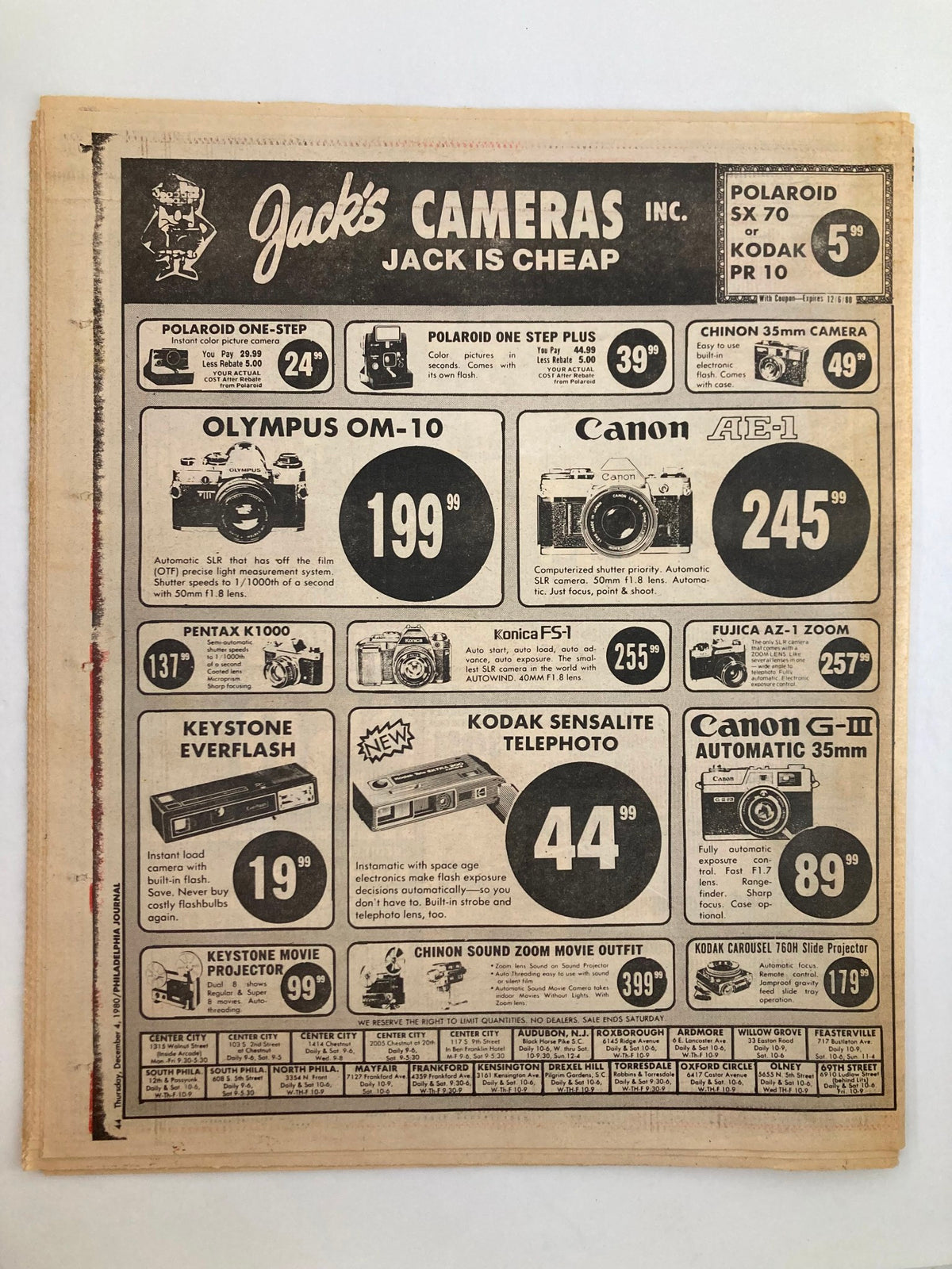 Vintage advertisement from Jack's Cameras featuring camera promotions including Olympus OM-10, Canon AE-1, and Kodak Sensalite Telephoto. This image is part of the Philadelphia Journal Tabloid from December 4, 1980, which highlights NBA superstar Julius Erving.