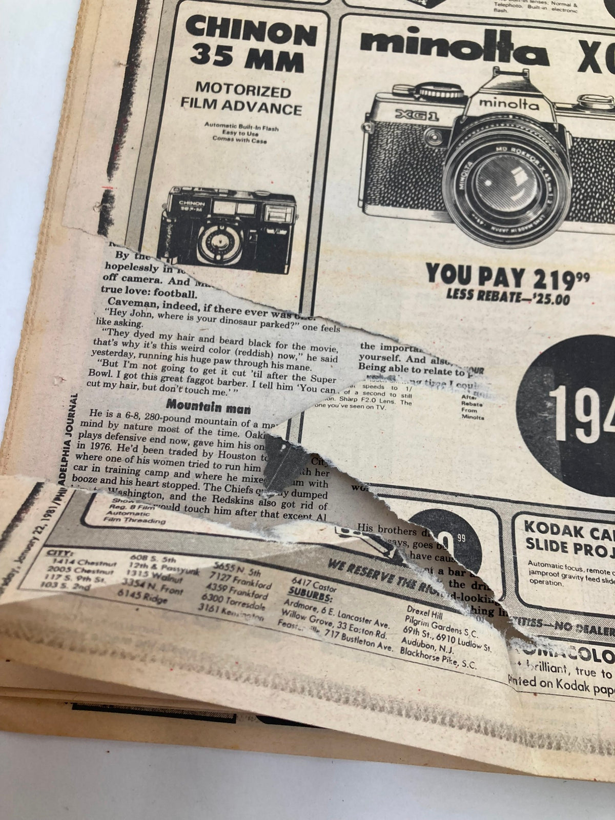 Close-up of the interior page of the Philadelphia Journal Tabloid showing advertisements and details, highlighting vintage photography equipment.