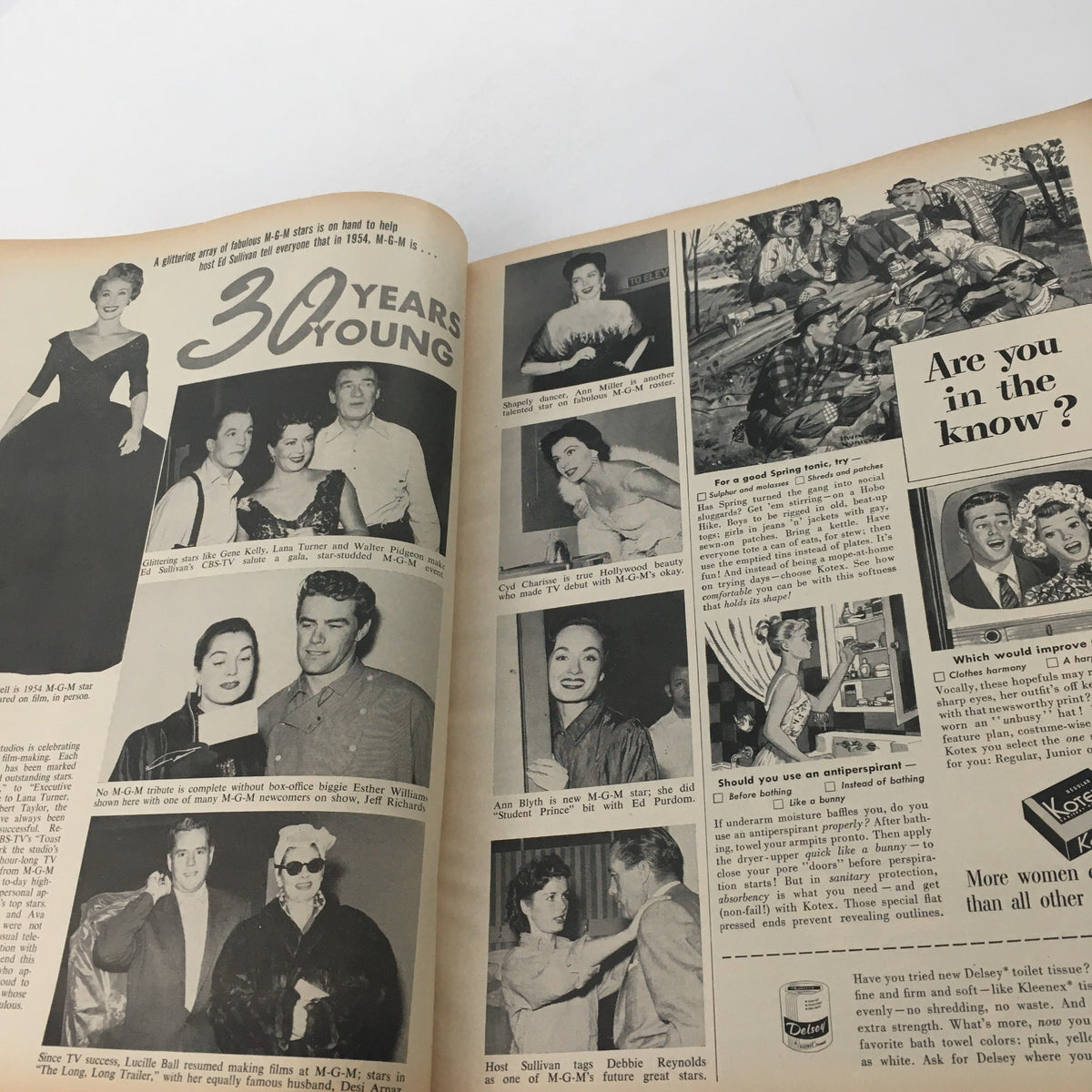 Interior page from VTG Movieland May 1954 magazine celebrating MGM's 30th anniversary with photographs of famous MGM stars. It features various artists and colorful visuals from Hollywood.