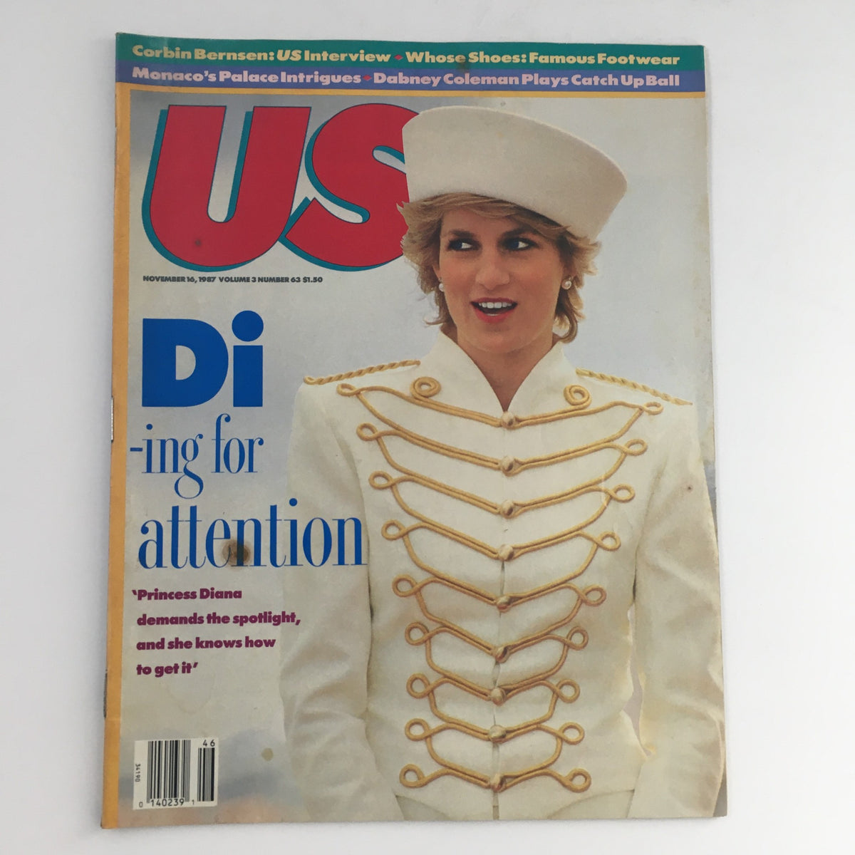 Cover of US Magazine Vol 3 #63, dated November 16, 1987, featuring Princess Diana of Wales in a stylish white military-style jacket with gold accents, under the headline 'Di-ing for attention.' This vintage magazine reflects the fashion and culture of the late 1980s.