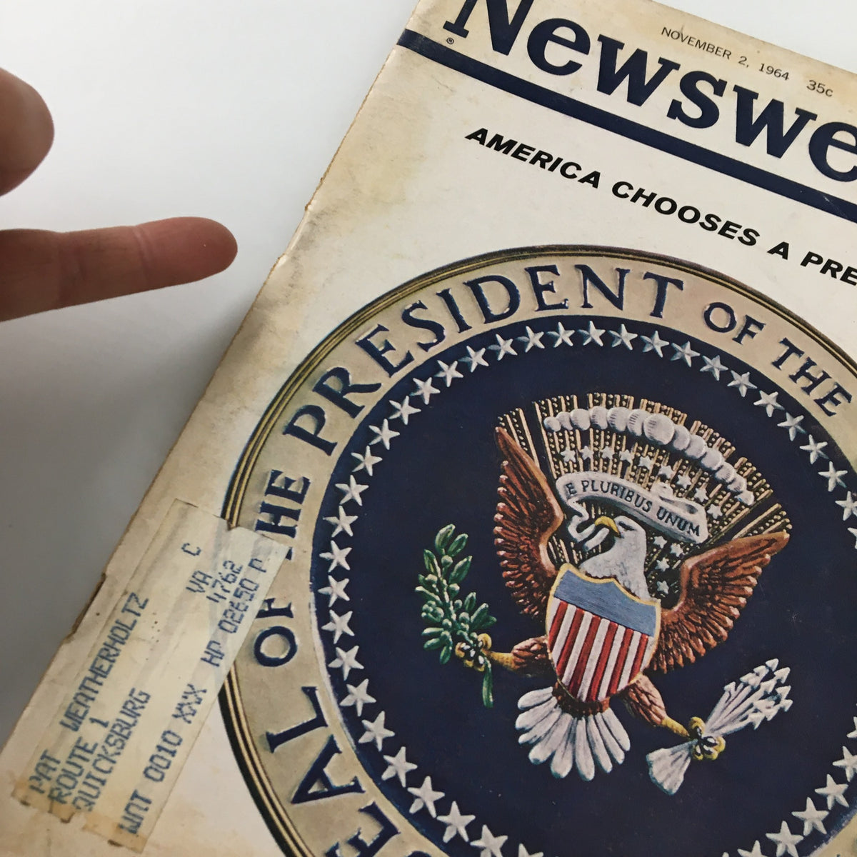 Close-up of the cover of VTG Newsweek Magazine November 2, 1964, 'America Chooses A President' highlighting the label and presidential seal.