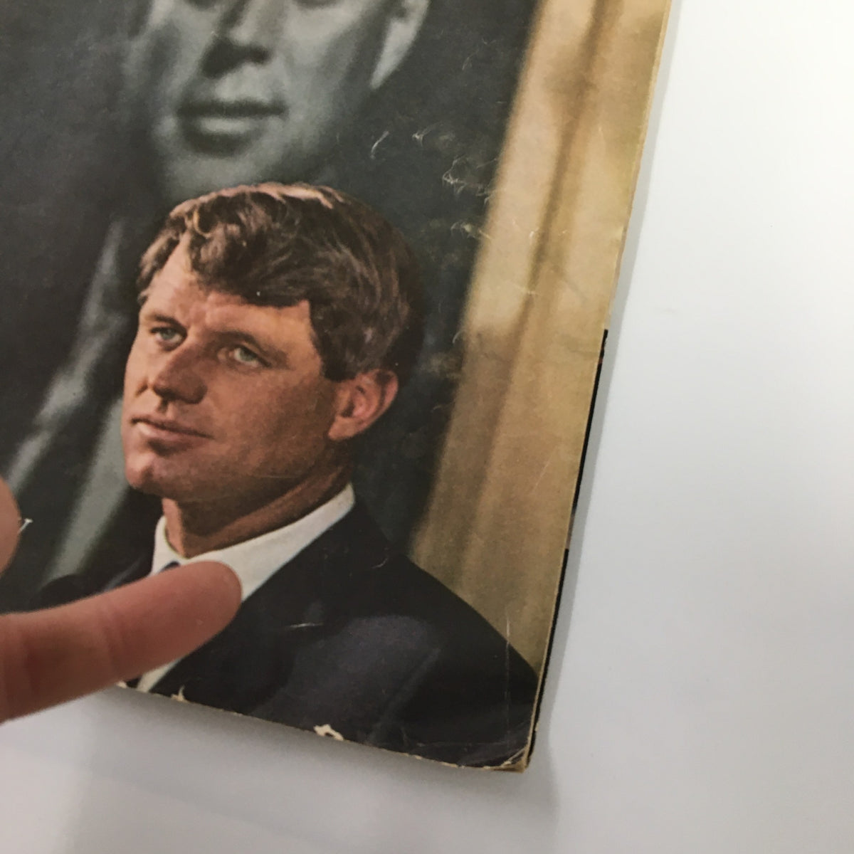 Close-up of VTG Newsweek Magazine June 17 1968, highlighting the face of Robert F. Kennedy and detail of the magazine cover, with a glimpse of the background featuring John F. Kennedy.