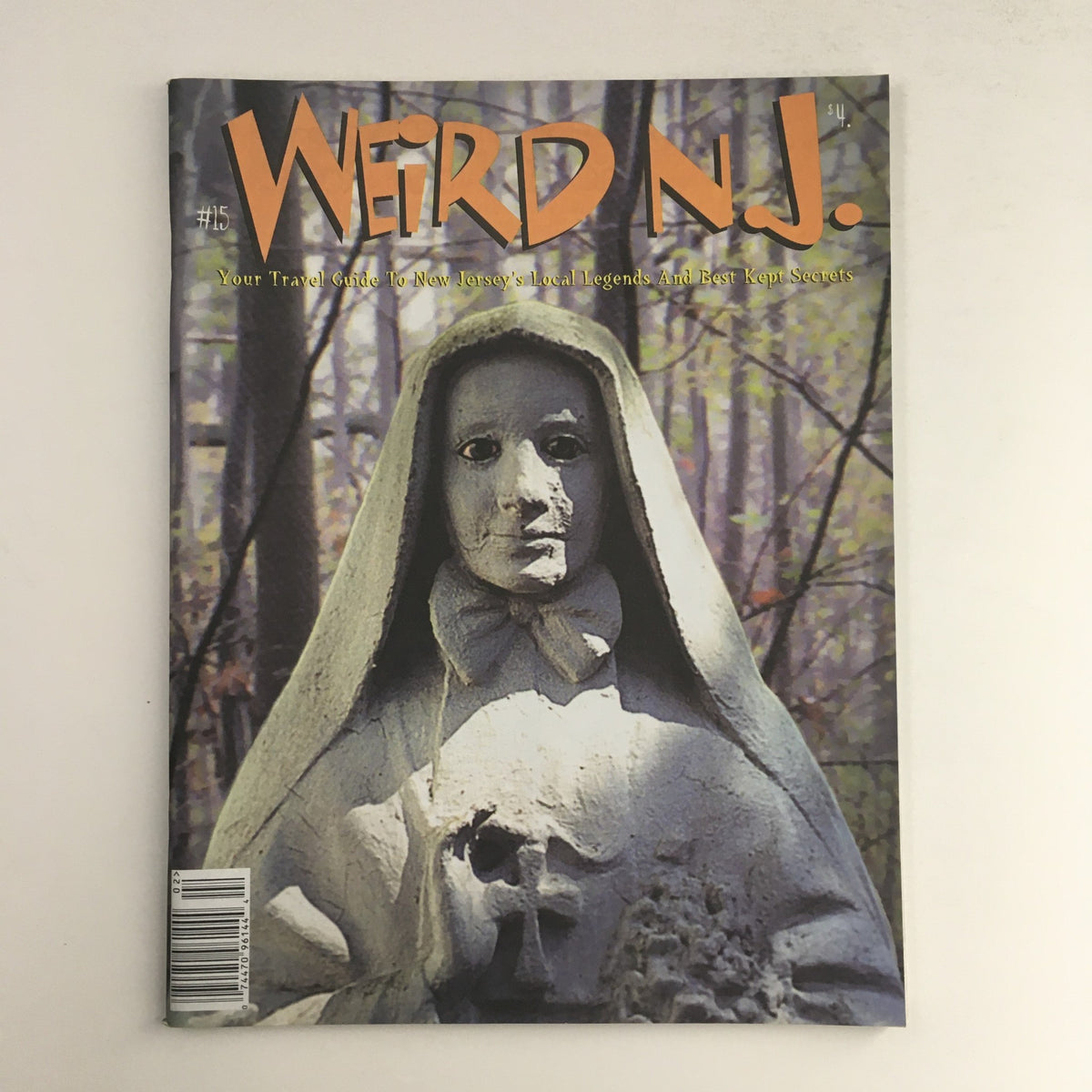 Weird N.J. Magazine 2000 #15, showcasing a unique cover that features a ghostly figure in a forest setting. This travel guide highlights New Jersey's local legends and best-kept secrets, making it a fascinating collectible for magazine enthusiasts.