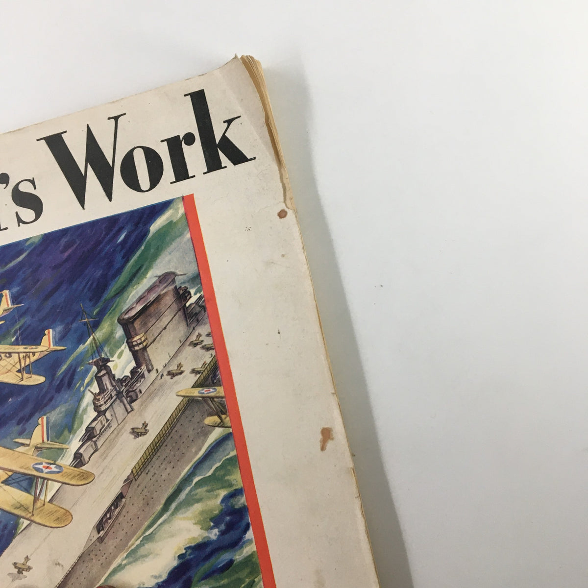 Side view of the worn cover of VTG World's Work Magazine December 1929, emphasizing the title 'World's Work' and nostalgic artwork depicting aviation themes.